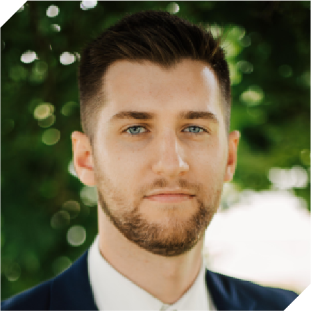 white man with short brown hair and a beard