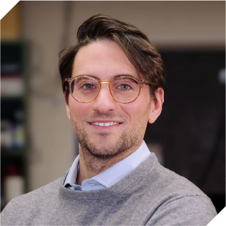 white man with short brown hair, glasses, and a beard