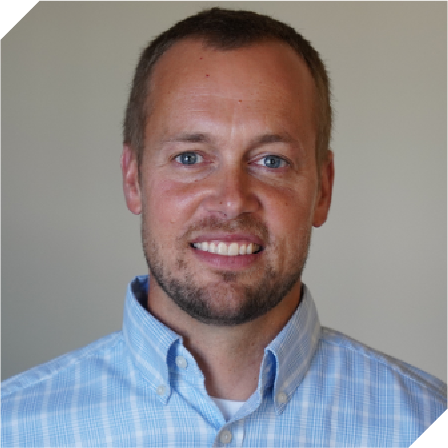 white man with buzzed brown hair and a beard