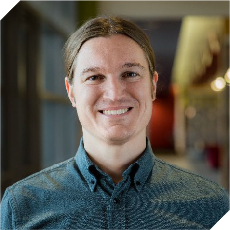 white man with long brown hair in a ponytail