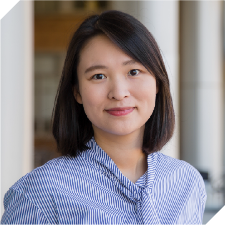 Asian woman with short, dark brown hair and side bangs